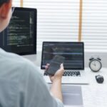 software development concept male programmer check h8n29xu